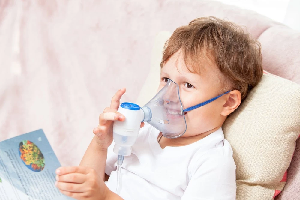 A boy with a nebulizer