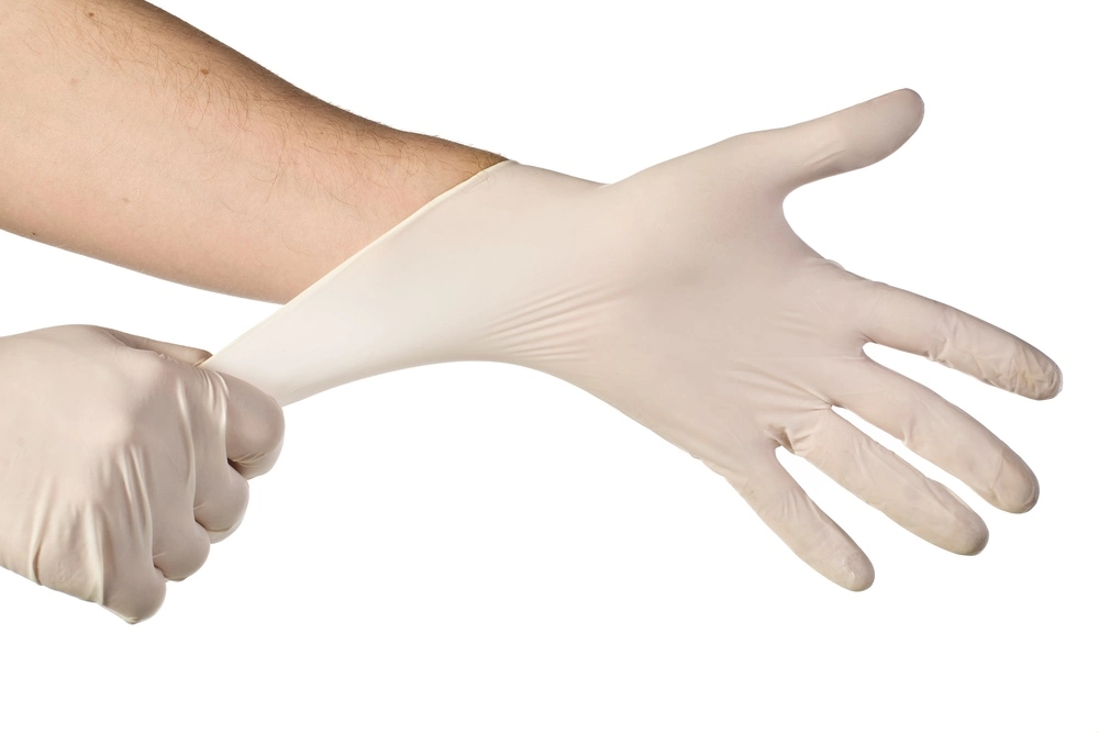 Hands wearing disposable gloves
