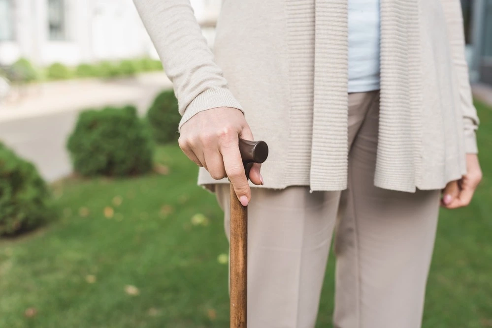 Woman with a walking cane